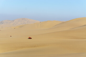 Fototapeta na wymiar A buggy car on desert in Ica, Peru. taking buggy car is popular adventure for tourist.