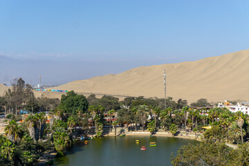 Fototapeta na wymiar Ica is a city located about 270 km from Lima, the capital of Peru. Fifteen minutes from Ica you will find the Huacachina Desert.