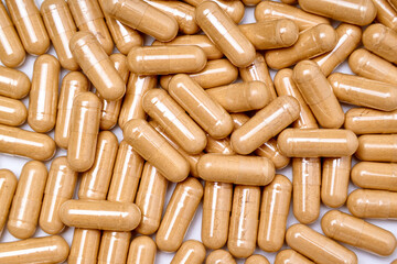 traditional indian medicine ashwagandha capsules isolated on white background, advertising copy space. top view