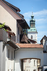 Church of Saint Jacob, or Cerkev Svetega Jacoba, seen from medieval narow street in the historical center of Skofja Loka, in Slovenia, in a district dating back from the middle ages...