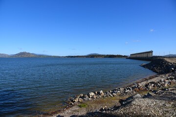 The Hume Dam, across the Murray River downstream of its junction with the Mitta River in the...