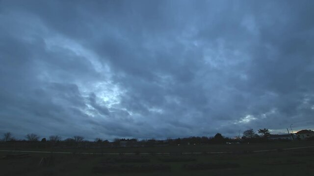 Time-lapse of the dark clouds moving in the sky, foreshadowing a rainstorm