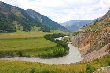 Fototapeta na wymiar winding turquoise river between mountains