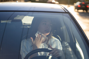 Girl driver being hot during heat wave in car, suffering from hot weather, has problem with a...
