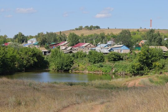 Country road and village near sprud, Samara region, August 2021