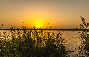 Fototapeta na wymiar beautiful gentle sunset over a quiet summer lake