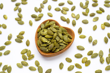 Pumpkin seeds on white background