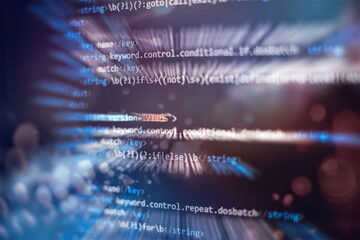 Notebook closeup photo. CSS, JavaScript and HTML usage. Monitor closeup of function source code.