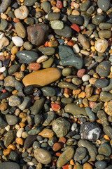 Multi coloured beach pebbles - view from above