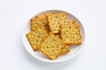 Seaweed crackers in white plate on white background.