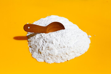 Baking soda on yellow background.