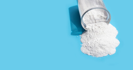 Baking soda on blue background.