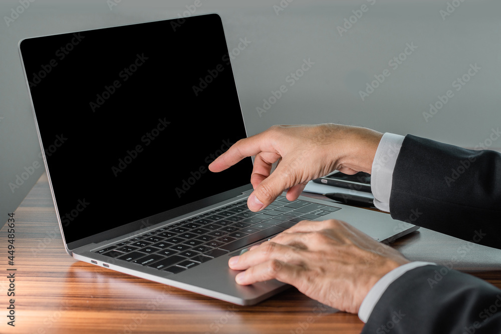 Poster businessman using computer in office, hand touch on screen monitor computer