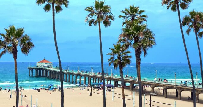 Tourists explore famous Manhattan Beach Pier landmark in Los Angeles, California, 4K