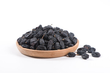 Dried black raisins isolated on white background