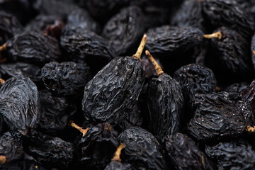 close up of black raisins textured background