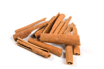 Aromatic dry cinnamon sticks on white background