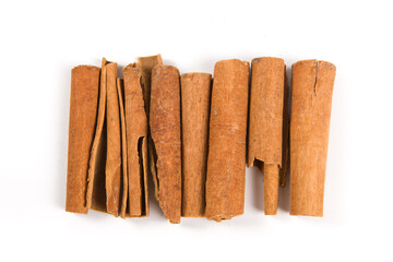 Aromatic dry cinnamon sticks on white background