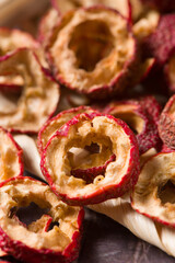 Dried hawthorn slices on wooden  background