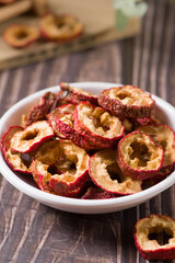 Dried hawthorn slices on wooden  background