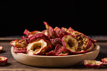 Dried hawthorn slices on wooden  background
