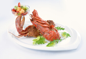 western baked whole cheese fresh lobster seafood with fruit cocktail salad in white background asian halal seafood menu