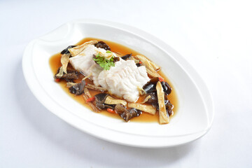 steamed slices grouper fish fillet with Chinese herbal fungus miso sauce seafood in white background asian halal seafood menu