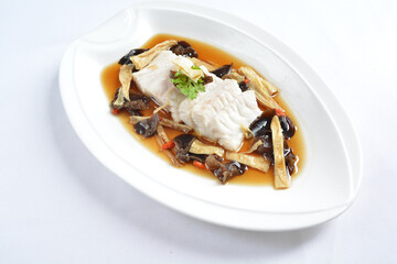 steamed slices grouper fish fillet with Chinese herbal fungus miso sauce seafood in white background asian halal seafood menu