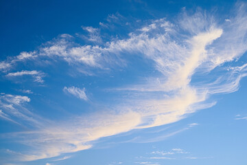 Naklejka na ściany i meble Floating clouds in the blue sky, sunny weather