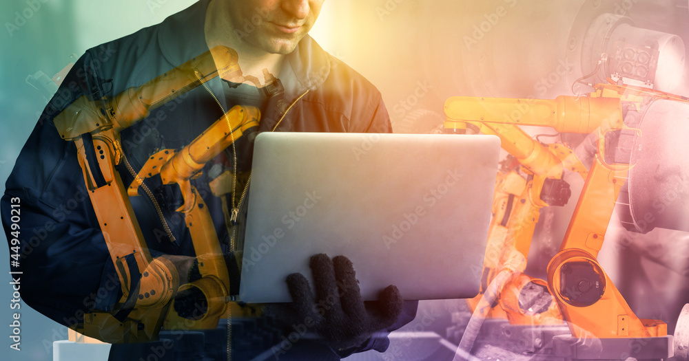 Poster mechanized industry robot arm and factory worker double exposure . concept of robotics technology fo