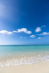Fototapeta na wymiar Beautiful beach under blue sky and white clouds, tourist attraction