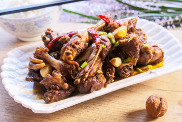 Close-up fried chicken drumsticks, rice, walnuts, chopsticks, depth of field