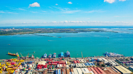 High angle view of containers at the dock under blue sky, commercial trade
