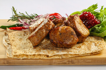 Pork tenderlion kebab over board