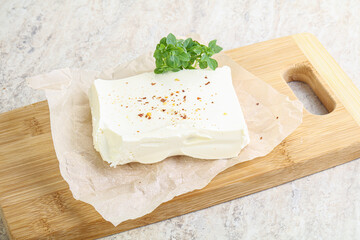 Greek Feta cheese over board