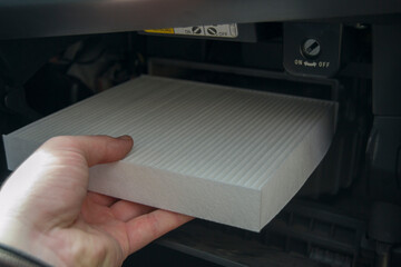 the process of installing the cabin filter. air purifier installed in the glove compartment