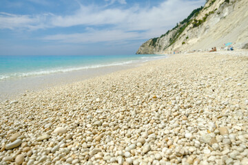 Fototapeta na wymiar Low angle view of beautiful beach with round pebbles
