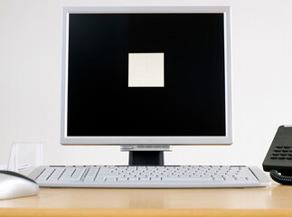 Computer Monitor with an Adhesive note on it