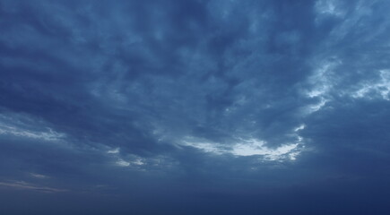 Naklejka na ściany i meble Blue clouds in the sky on a summer evening