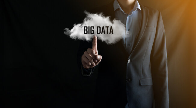 Businessman holds the inscription BIG DATA. Padlock , brain ,man, planet,graph, magnifier, gears, cloud, grid, document, letter, phone icon.