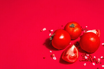 Naklejka na ściany i meble Ripe tomatoes with rose Himalayan salt and pink peppercorn