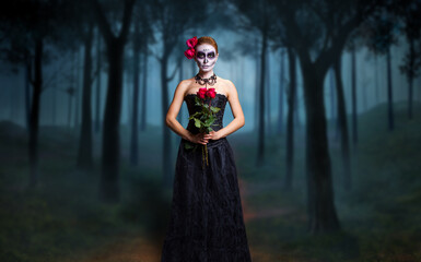 young woman with sugar skull makeup, showing Calavera Catrina. Dia de los muertos. Day of The Dead....
