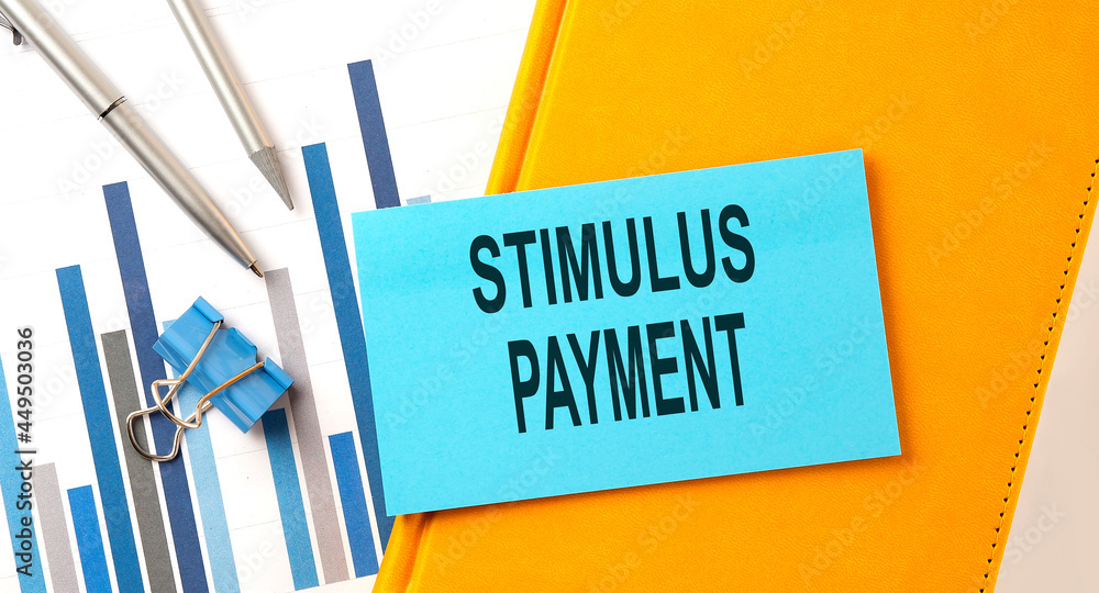 Poster stimulus payment text on sticker on yellow notebook with chart and pen