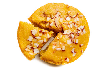 A large-sized ripe palmyra palm fruit cake sprinkled with coconut pieces. Steamed palmyra palm cake in isolated white background.