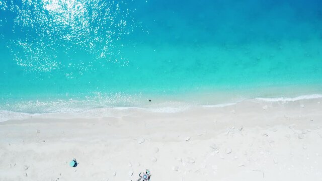 Drone shot of beautiful scenic beach with white sand and turquoise blue sea water, summer holiday in Greece, Egremni beach of Lefkada island.