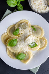 Ravioli with ricotta, spinach and basil in a white plate