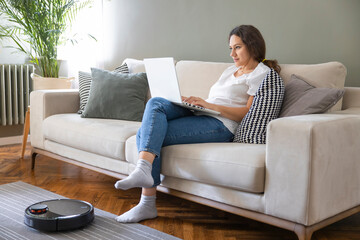 Robot vacuum cleaner cleaning the living room.