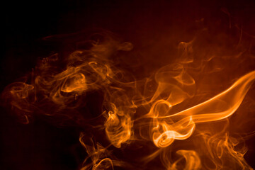 Fototapeta premium Gold smoke on black background.