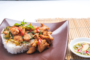 Stir fried chicken with basil over rice