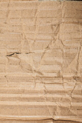 Brown cardboard torn crumpled.